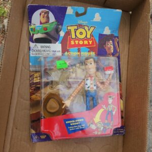 57_2b7ec49f-daf3-439c-bc02-930bba5fa297.jpg (SEALED) Toy Story - Knock-Down Woody Action Figure - Disney 1995 MOC 62881